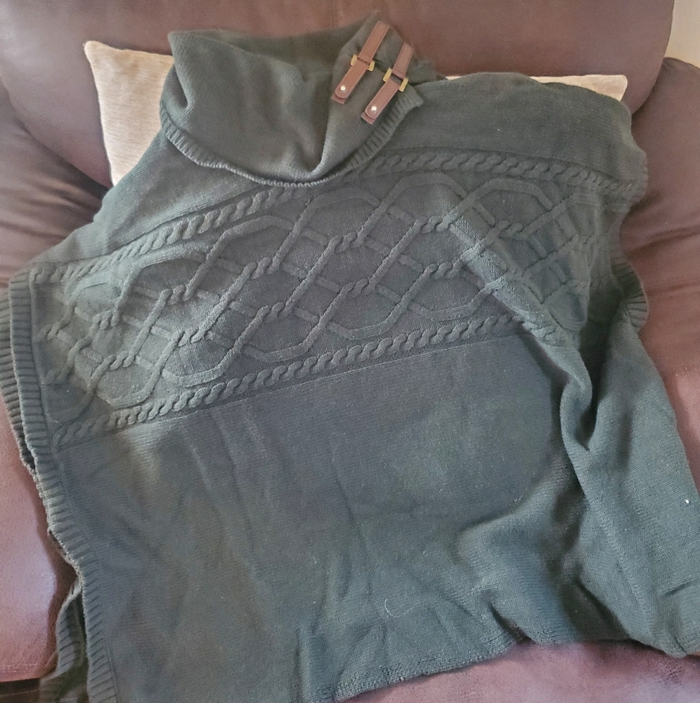 Knit poncho with buckle detail